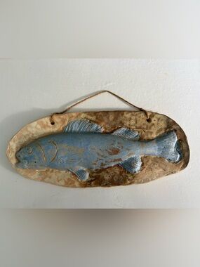 Handmade ceramic hanging plaque blue fish on mottled brown/tan